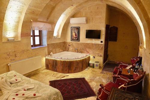 A bed or beds in a room at Avanos Suites