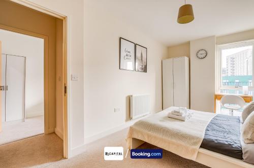 a bedroom with a bed and a window at Last-Minute Secure l Sleeps Up to 8 l 2 Bedroom Apt By Capital Retreats Short Lets & Serviced Accommodation London With Balcony, Free WiFi in Colindale