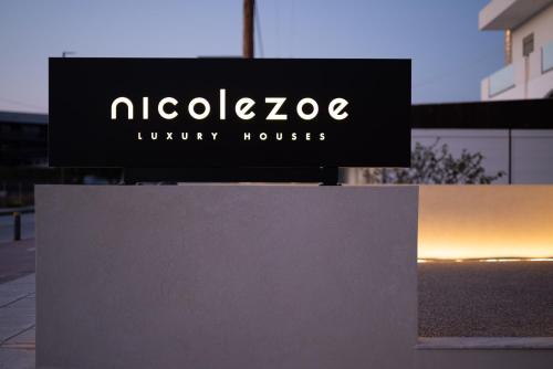 a sign that reads nelvo luxury houses at Beach Luxury Homes - Zoe in Lampi