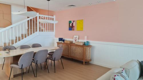 a dining room with a table and chairs at 2 - BLUE WORLD - Al Dana Villas in Fujairah