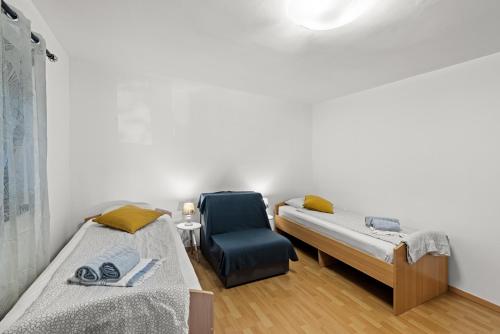 Ένα ή περισσότερα κρεβάτια σε δωμάτιο στο Sea View apartments with shared Pool