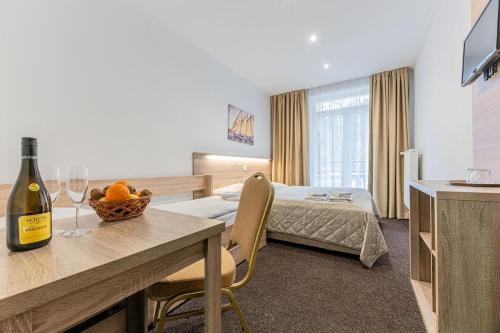 A bed or beds in a room at Hotel Hrabovo