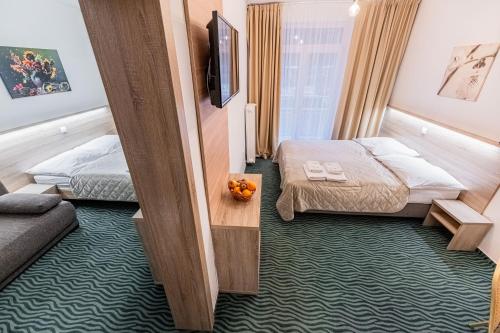 Ένα ή περισσότερα κρεβάτια σε δωμάτιο στο Hotel Hrabovo