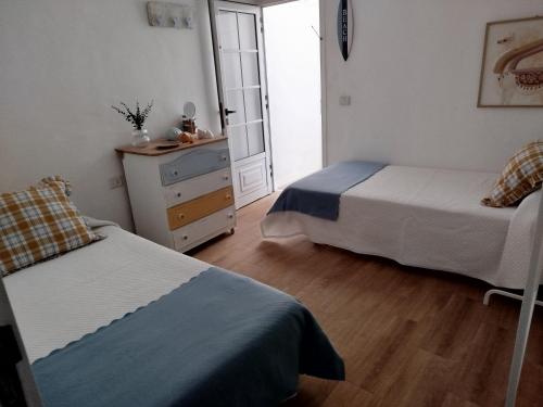 Ένα ή περισσότερα κρεβάτια σε δωμάτιο στο Casa Sebadal