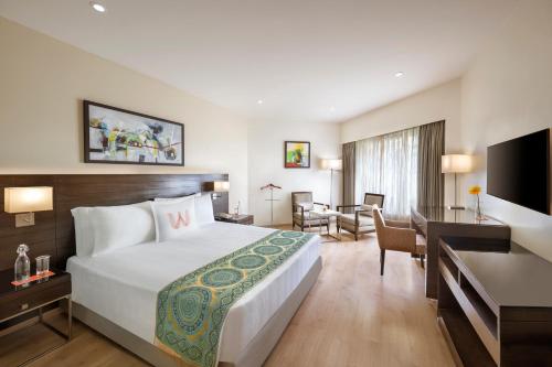 Postel nebo postele na pokoji v ubytování Welcomhotel by ITC Hotels, Rama International, Aurangabad