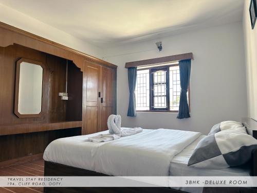 Ένα ή περισσότερα κρεβάτια σε δωμάτιο στο Travel & Stay