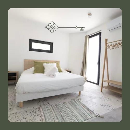 Una cama o camas en una habitación de Incroyable Studio à 5 min des Plages