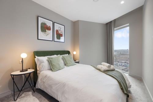 a bedroom with a large bed and a window at ShyTower in London