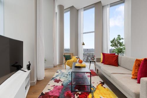 a living room with a couch and a table at ShyTower in London