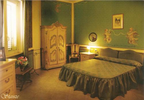 Giường trong phòng chung tại Hotel Rinascimento