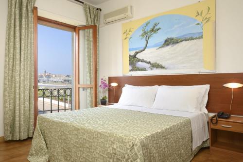 Postel nebo postele na pokoji v ubytování Hotel Il Gabbiano