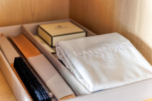 a drawer filled with utensils and a box with knives at Polo Club - Hotel in Ufton