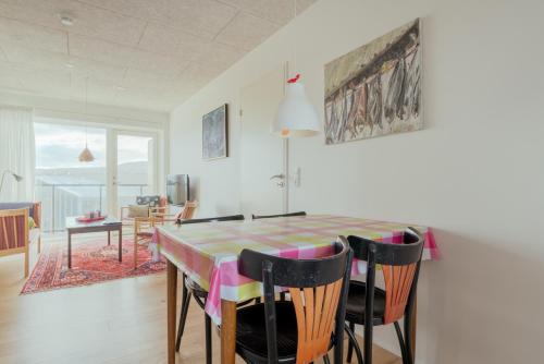 a dining room with a table and chairs at 1 BR Apartment - Tórshavn - Parking in Tórshavn