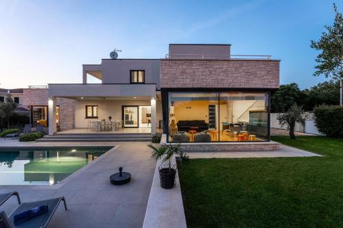 Villa Anni for 10 people in Porec with heated pool, sea view & kids room and playground