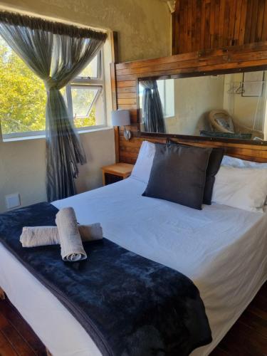 a bedroom with a bed with a towel on it at Yello Hotel in Strand