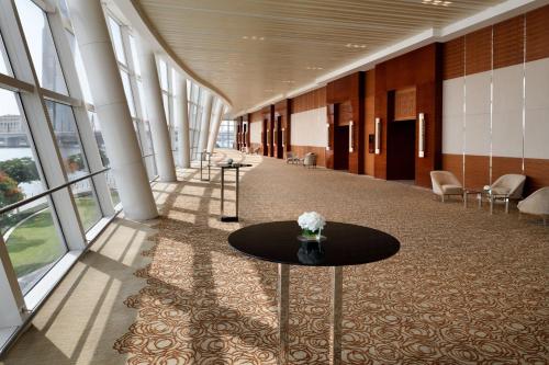 a hallway with a table in the middle of a building at InterContinental Dubai Festival City by IHG in Dubai