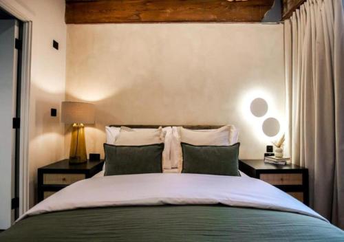 a bedroom with a large bed with two night stands at Organica by The Heim in Manchester