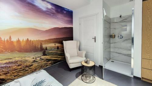 a bedroom with a wall mural of a mountain view at Apartamenty Słoneczna Góra w spokojnej okolicy - Dream Apart in Szczyrk