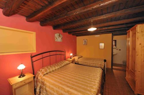 Postel nebo postele na pokoji v ubytování Casale Drinzi