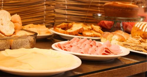 a buffet of different types of food on a table at Pousada Princesa do Sertão in Piranhas
