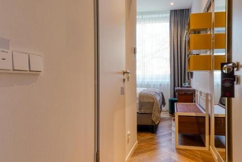 Cama o camas de una habitación en Vienna House Easy by Wyndham Hamburg Bergedorf