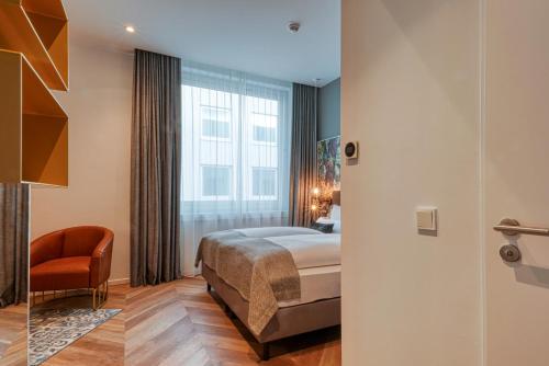 Cama o camas de una habitación en Vienna House Easy by Wyndham Hamburg Bergedorf