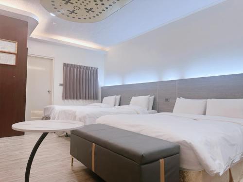 Ένα ή περισσότερα κρεβάτια σε δωμάτιο στο Hua Du Motel