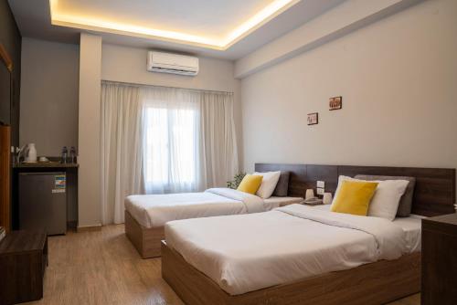 Letto o letti in una camera di Al Dora Residence Suites Hurghada