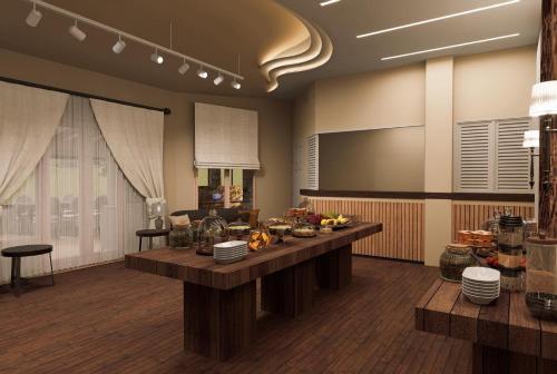 a living room with a table with food on it at Ktima Faki, Olympus Mountain Accommodation & Retreat in Litochoro