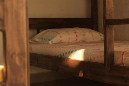 a bunk bed with a pillow on top of it at San Julio Campestre in Borrero Ayerbe