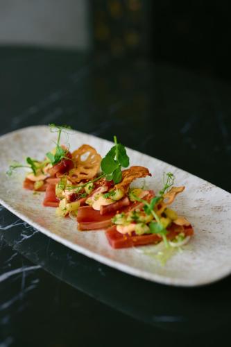 a plate of food with vegetables on a table at Hotel Keflavik by Reykjavik Keflavik Airport in Keflavík