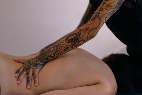 a woman with a tattoo on her arm at Grand Hotel Du Golfe - Spa & Restaurant in Collioure