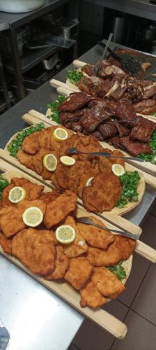 a table with a bunch of food and chop sticks at Villa Victoria Penzion in Liptovský Ján