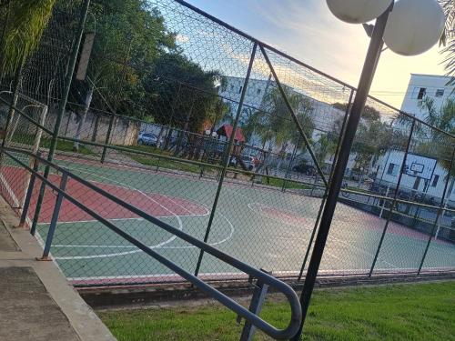 a tennis court with two tennis courts at Nosso apê in Pindamonhangaba