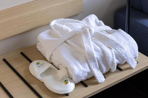 a white towel sitting on top of a table at Hyatt Place Rouen in Rouen