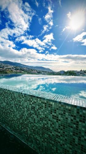 a view of the ocean from a building at Casa de Viriato in Funchal