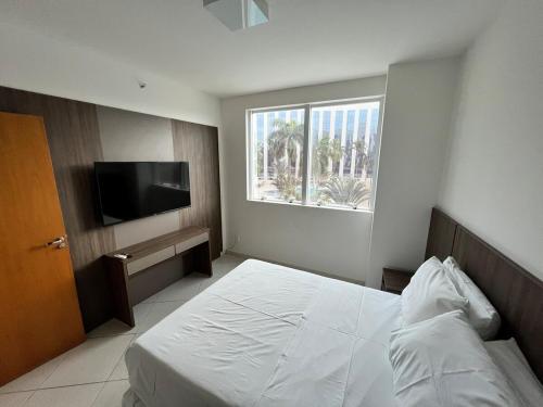 Ένα ή περισσότερα κρεβάτια σε δωμάτιο στο Flat dentro do Parque do Peão de Barretos