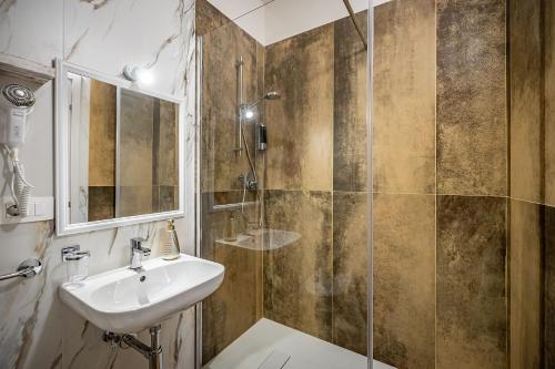 a bathroom with a sink and a shower at Florence Ventuno B&B in Florence