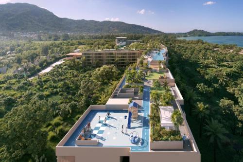 an aerial view of a building with a resort at Laguna beachside residences by My home Phuket in Bang Tao Beach