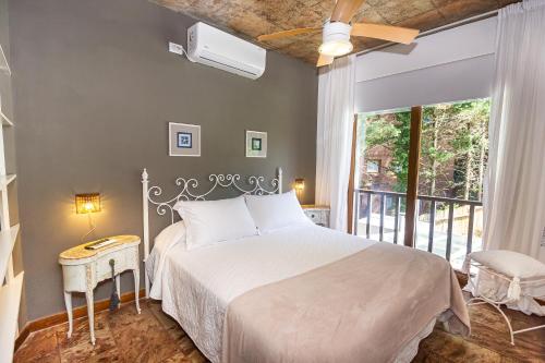 Ένα ή περισσότερα κρεβάτια σε δωμάτιο στο Punta Cerezo Apart
