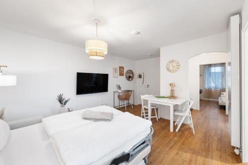 Televisyen dan/atau pusat hiburan di ANYTIME - Apartments in Langenargen