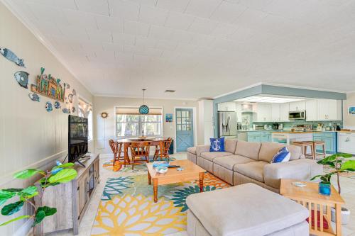 a living room with a couch and a table at Dock and Lanai Riverview Homosassa Escape! in Homosassa