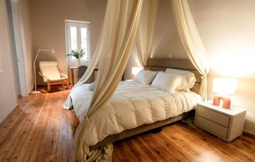 a bedroom with a bed with a canopy at Acropolis 360 Residence,2 bedr in Athens