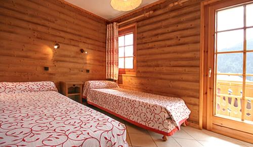 Postel nebo postele na pokoji v ubytování Appartement moderne à Châtel 60 m² avec terrasse privée