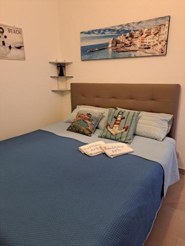 a bed with two pillows on top of it at A & B Holiday Home in Deiva Marina
