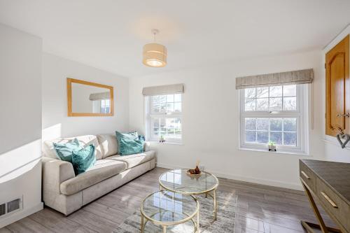 a living room with a couch and a table at Cosy Apartment in Wetheral,Cumbria in Wetheral