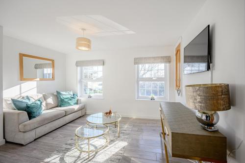 a living room with a couch and a table at Cosy Apartment in Wetheral,Cumbria in Wetheral