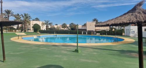 a large swimming pool in the middle of a resort at Villa Evelina Puerto Rey Vera in Vera