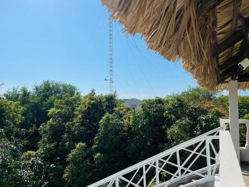 a view from a roof of a house with trees at Villa Rosa Bella Perfect for families or groups in Palmar de Ocoa