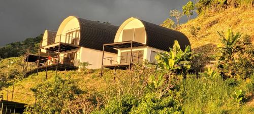 a house on the side of a hill at Tierra Vital Atenas Villa 2 in Atenas